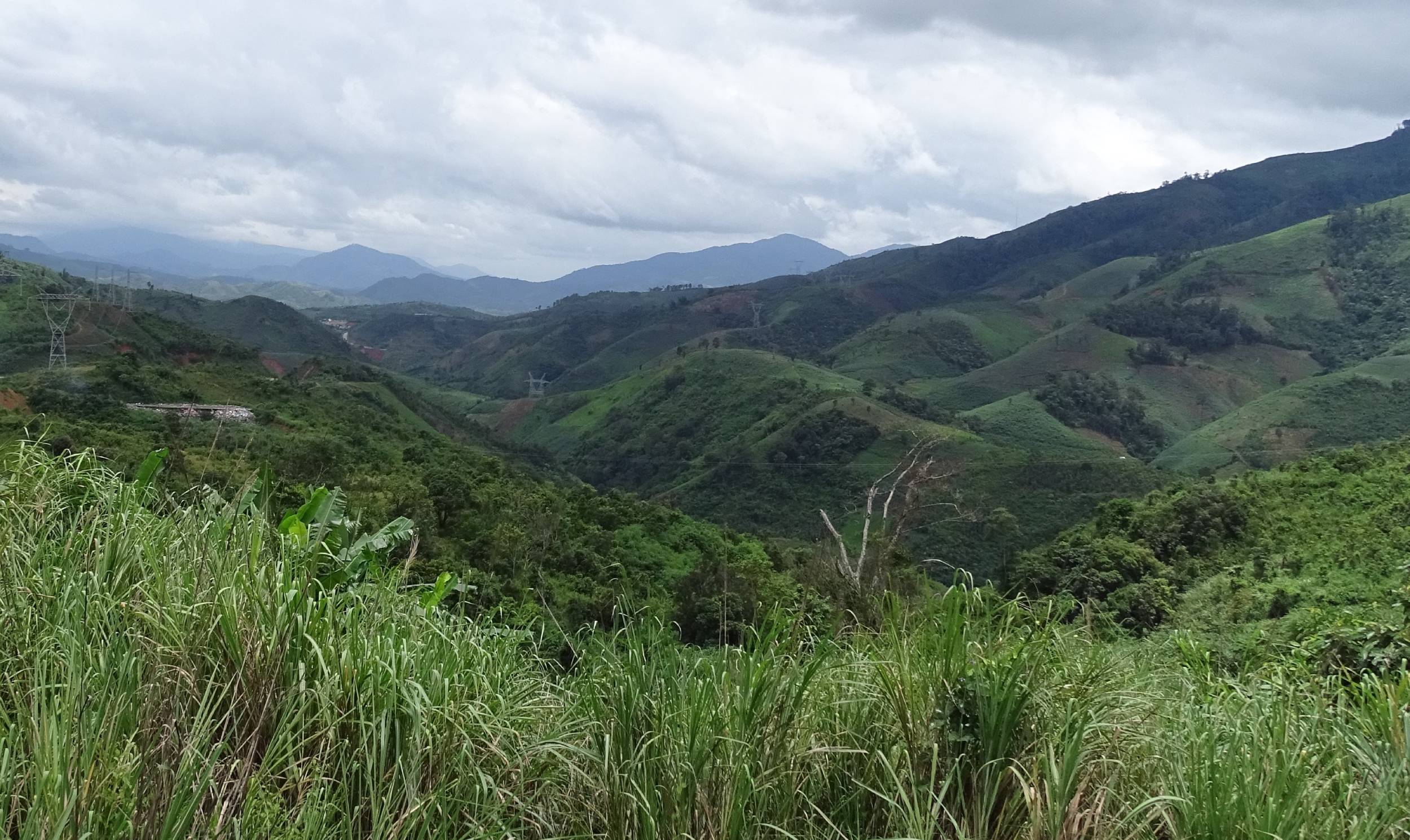 View at the green mountains from the road between Kon Tum and Da Nang